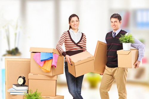 Professional movers loading furniture during a Highamspark relocation